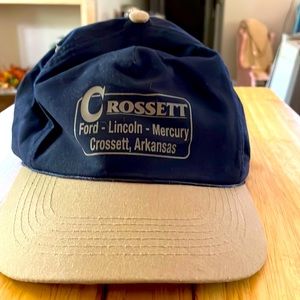 Two tone lid. Navy blue and tan. Snapping straps made china. Casual lightweight